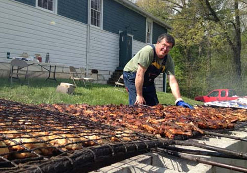 Rick cooking chicken fundraisers